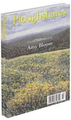 A journal cover of a field of yellow flowers overlooking multiple green mountains
